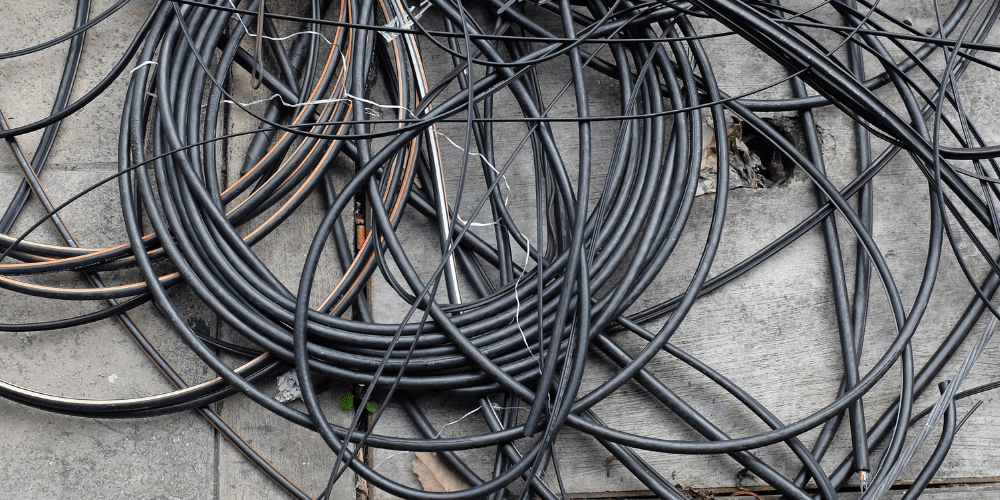 Hand stripping cable with a knife compared with machine granulation Bare bright copper offcuts kept in a separate container ready for weighing