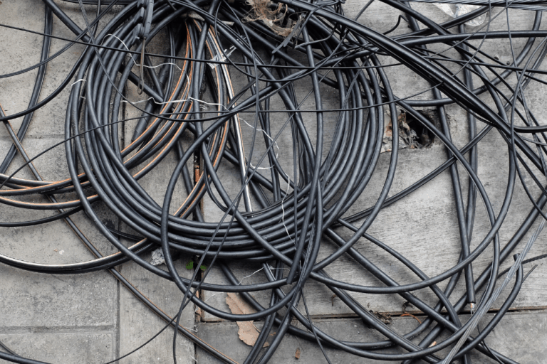 Hand stripping cable with a knife compared with machine granulation Bare bright copper offcuts kept in a separate container ready for weighing
